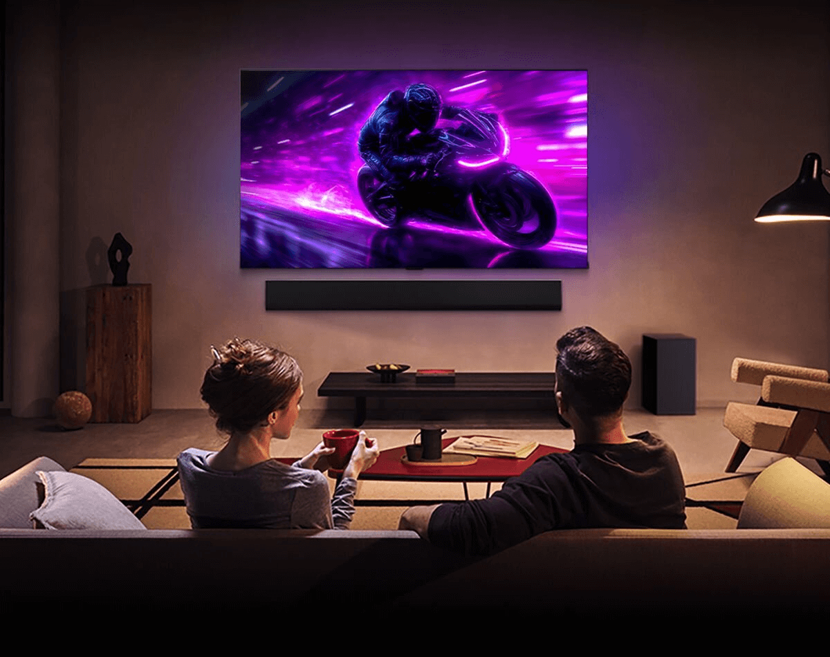 LG image of a couple watching a hi definition gaming TV.