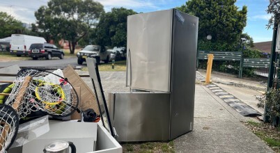 An abandoned old fridge on a nature strip in Australia, awaiting council hard rubbish collection.