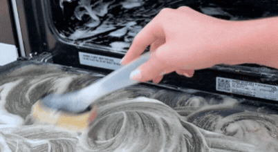 Cleaning the interior glass door of an oven