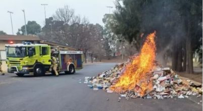 A pile of rubbish on fire on a street in Canberra: the fire was caused by lithium-ion batteries that had not been safely disposed of.