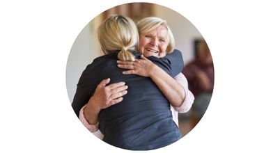 A woman hugging her mother
